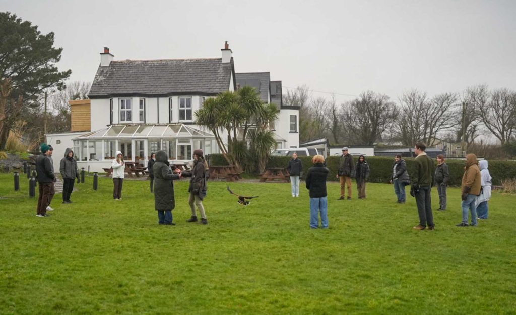 A group of visitors enjoying a demonstration
