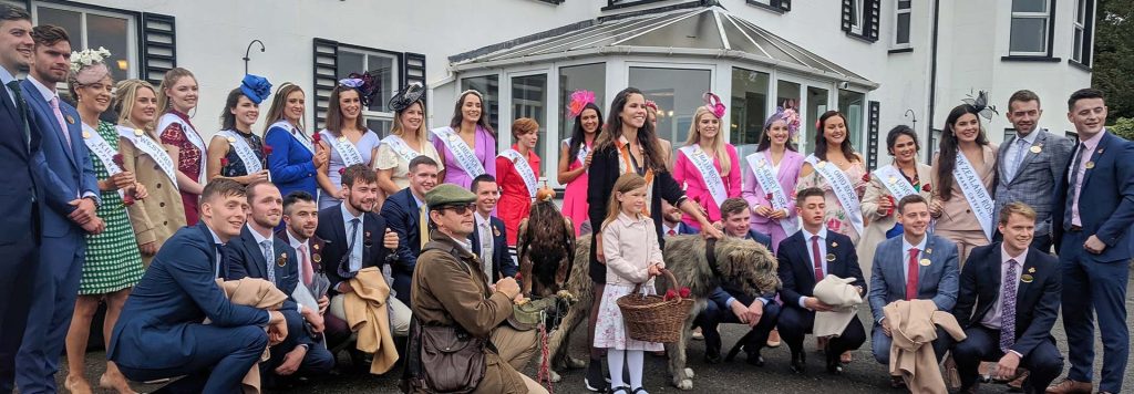 A group of happy visitors posing for a picture